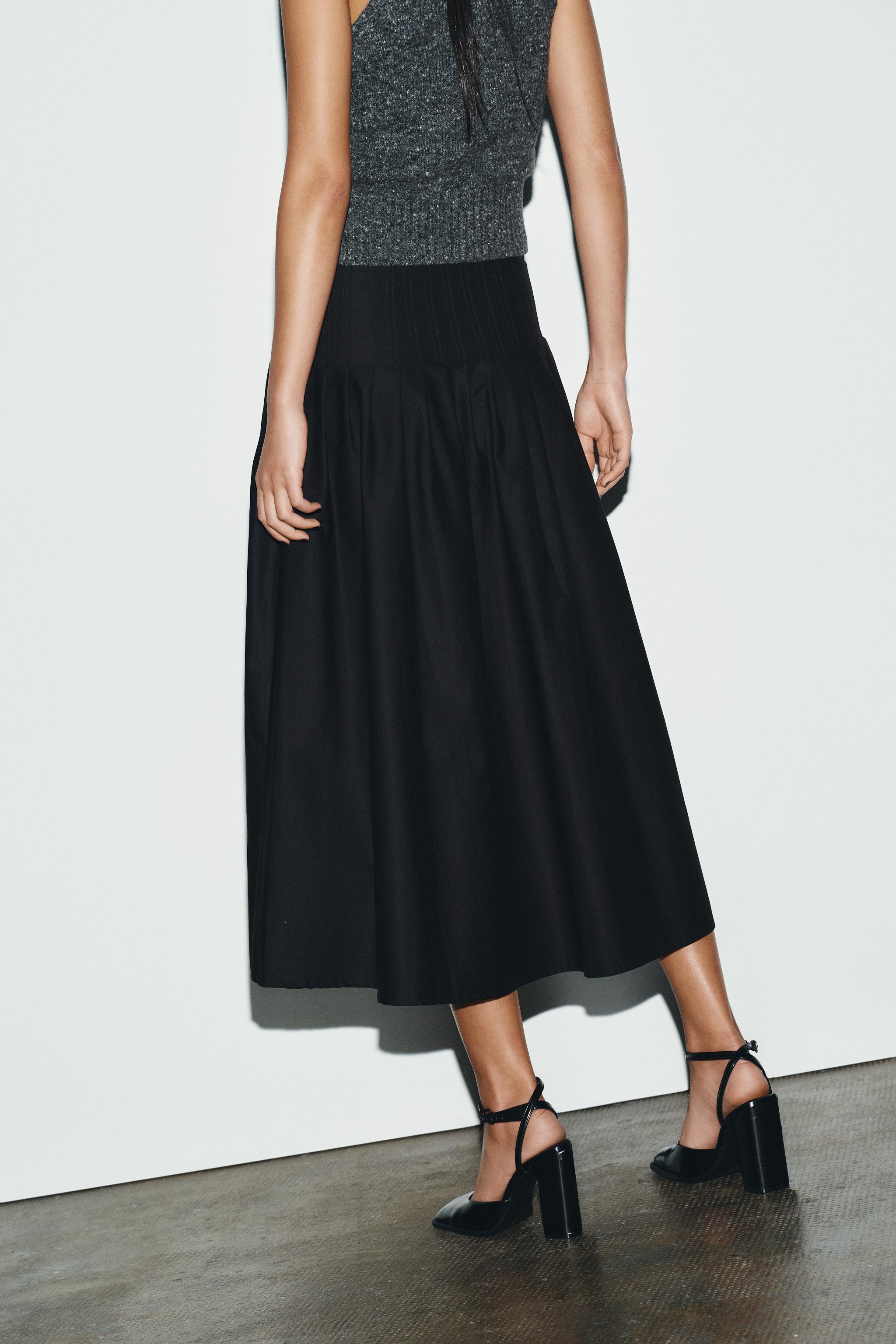 PLEATED MIDI SKIRT
